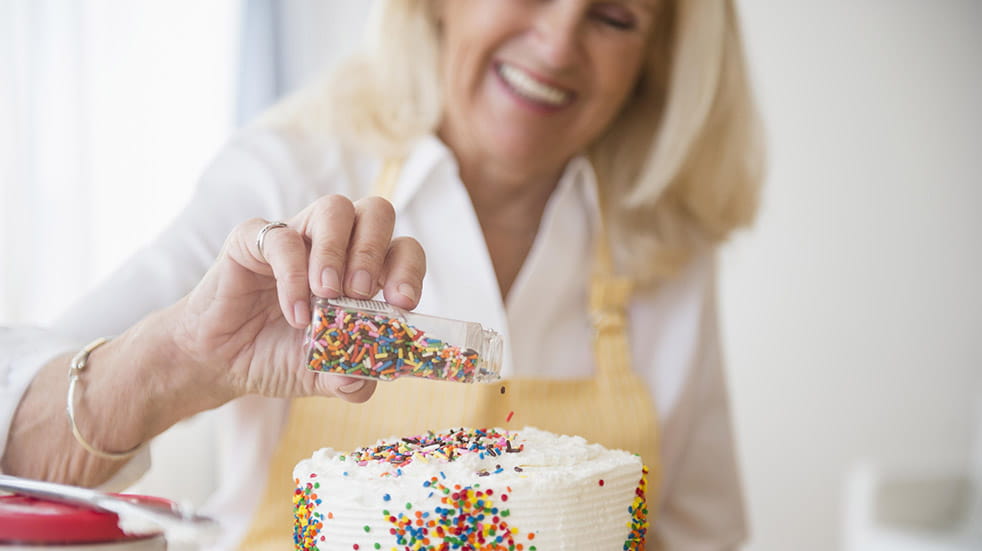 Crafting for mental health; woman decorating cake